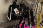 a display of handbags including a marc jacobs tote bag