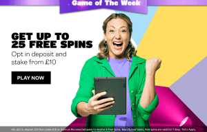 a woman in a green jacket is holding a tablet in front of a sign that says get up to 25 free spins